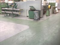 Tiles & resin in manufacturing hall.